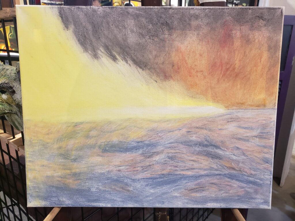 a white light with yellow tails flies from left to right over a choppy sea, the background is black with a fiery burst near the right.