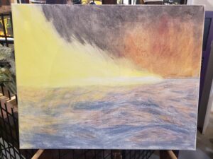 a white light with yellow tails flies from left to right over a choppy sea, the background is black with a fiery burst near the right.